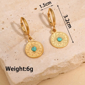 Detailed view of evil eye heart earrings with turquoise and size dimensions 1.5cm by 3.2cm
