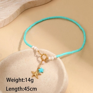 Macro detail of summer beaded necklace with starfish pendant and freshwater pearls