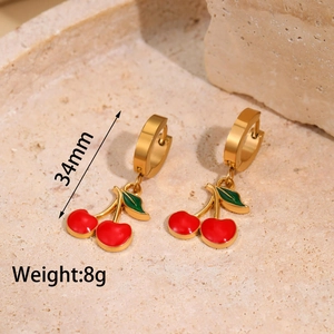 Macro view of gold-plated cherry drop earrings with 34mm height and 8g weight detail