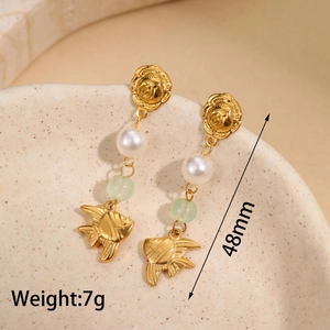 Detailed view of gold rose and angel fish earrings with pearls, 48mm length and 7g weight