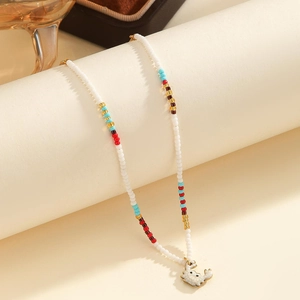 Bohemian beaded necklace with colorful spacers and a cute white crab charm pendant