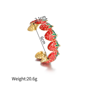 Detail showing red strawberry open cuff bracelet with dimensions 2.1cm and 6cm diameter