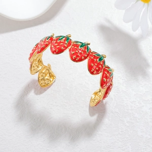Adjustable 18k gold plated stainless steel open bangle featuring red strawberry charms