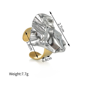 Detail view of two-tone 18k gold and silver ring with lava texture and size dimensions