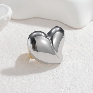 Elegant two-tone 18k gold and silver heart ring with a polished mirror finish