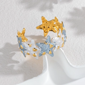 Gold and blue starfish cuff bracelet in marine style for summer beach holiday wear