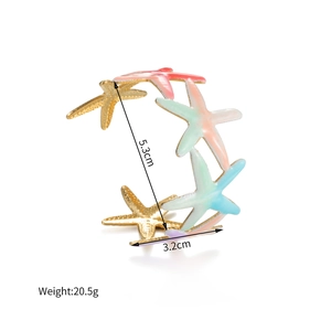Detailed view of colorful 18k gold starfish cuff bracelet with size and weight specs