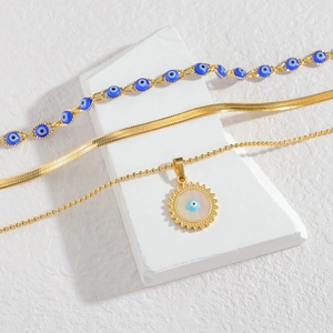 Ensemble bijoux mauvais œil plaqués or avec pendentif soleil et collier chaîne serpent