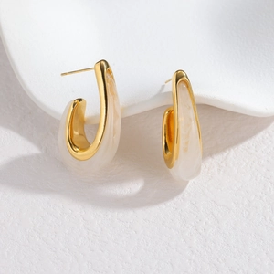 Minimalist C-shaped gold metal earrings with marble white resin texture inlay