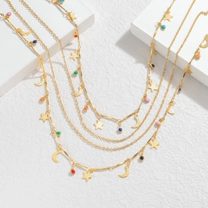 Bohemian gold layered necklace set with colorful beads, stars, and moon pendants