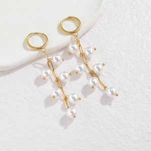 Vintage gold hoop earrings with long pearl tassels and asymmetrical fringe drops