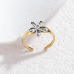 Minimalist two-tone open flower ring with silver petals and a small central zircon stone