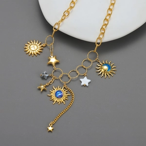 Elegant gold plated stainless steel necklace with sun and star celestial pendants