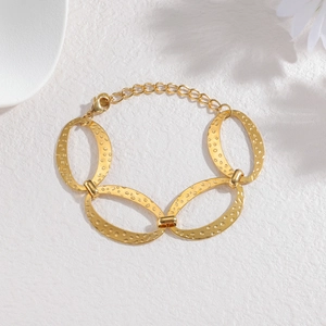 Golden oval link bracelet with hammered texture and adjustable chain for women