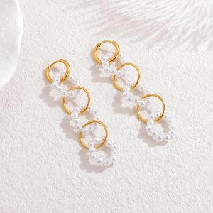Long geometric tassel earrings with 18k gold chain links and white pearl hoops