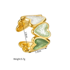 Technical view showing the 1.8cm height and 5.7g weight of this enamel heart ring