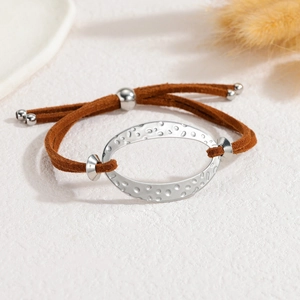 Minimalist geometric oval hollow bracelet with brown suede rope and silver hammered texture