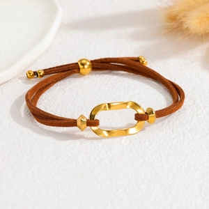 Adjustable brown suede cord bracelet with 18k gold wavy geometric oval ring focal