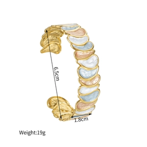 Detailed view of enamel drop bangle with 6.5cm diameter and 1.8cm width dimensions