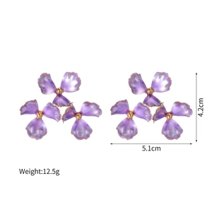 Detail view of purple enamel flower earrings with gold edges and size dimensions