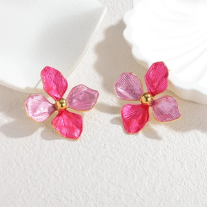 Elegant 18k gold floral stud earrings featuring purple and pink enamel petals