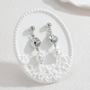 Baroque pearl tassel earrings in stainless steel with liquid metal organic design