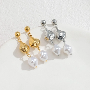 Bohemian baroque pearl drop earrings in gold and silver finish with lava metal detail