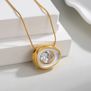 18k gold plated snake chain necklace with large oval cubic zirconia pendant on white stand