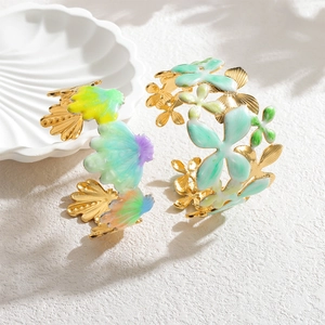 Wide enamel floral and shell bangle set in gold finish with vibrant summer colors
