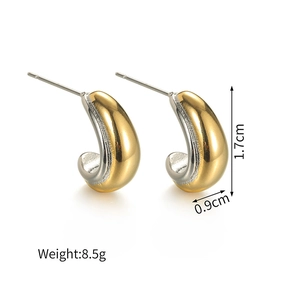 Macro detail of two-tone C-shape earrings showing gold and silver finish with dimensions