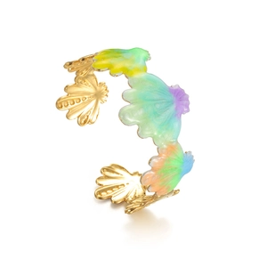 Wide gold-tone open cuff bracelet featuring multi-colored enamel shell patterns