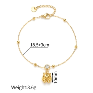 Detail of 18k gold plated owl charm bracelet with zircon inlay and lobster clasp