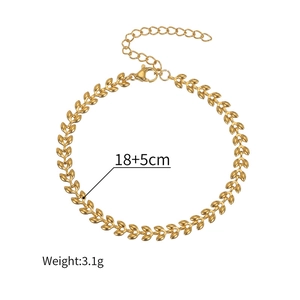 Detail of 18k gold wheat chain link with lobster clasp and adjustable ring extension