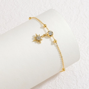 Minimalist 18k gold plated stainless steel bracelet featuring star and crystal pendants