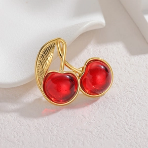 Elegant 18k gold cherry brooch with red translucent resin fruit and leaf detailing