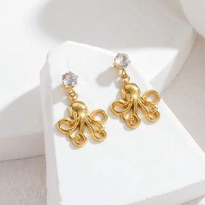 Boucles d'oreilles pieuvre dorées avec zircone sur base de pierre géométrique minimaliste