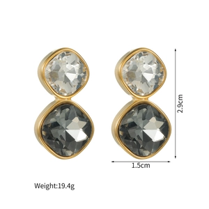Macro shot of geometric square zircon earrings showing dimensions 2.9cm by 1.5cm