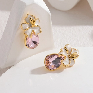 Elegant gold flower earrings with white enamel petals and pink teardrop zircon pendants