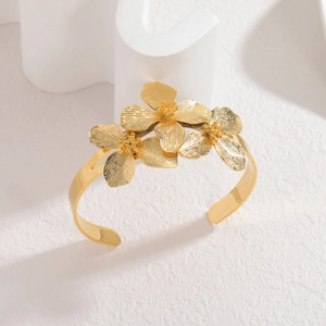 18k gold plated stainless steel open bangle with triple floral motif and brushed texture