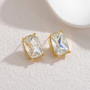 Exaggerated geometric gold stud earrings with rectangular cubic zirconia stones