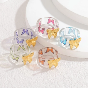 5-piece set of transparent acrylic butterfly rings in multiple vibrant colors