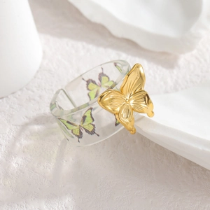 French palace style golden butterfly ring with transparent acrylic band and green pattern