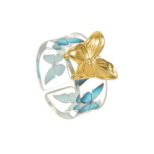 Minimalist 18k gold butterfly ring with clear resin band and blue butterfly motif