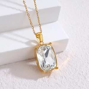 Minimalist 18k gold geometric necklace with a large clear rectangular zircon pendant