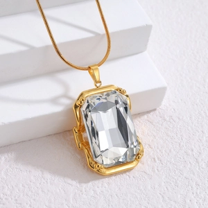 Elegant 18k gold plated necklace with square clear zircon on white display steps