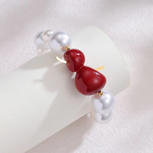 Bracelet en perles d'acier inoxydable plaqué or 18k avec un pendentif gourde rouge