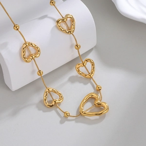 Collier chaîne serpent en acier inoxydable doré 18k avec pendentifs cœurs évidés