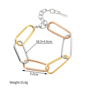 Detailed view of tri-color geometric link bracelet with lobster clasp and extension