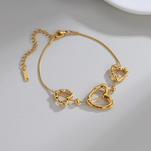 Elegant 18K gold-plated stainless steel snake chain bracelet with hollow heart charms