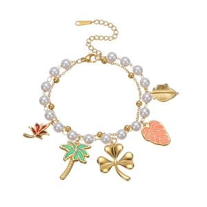 Double-layer stainless steel pearl bracelet with tropical leaf charms in 18k gold plating